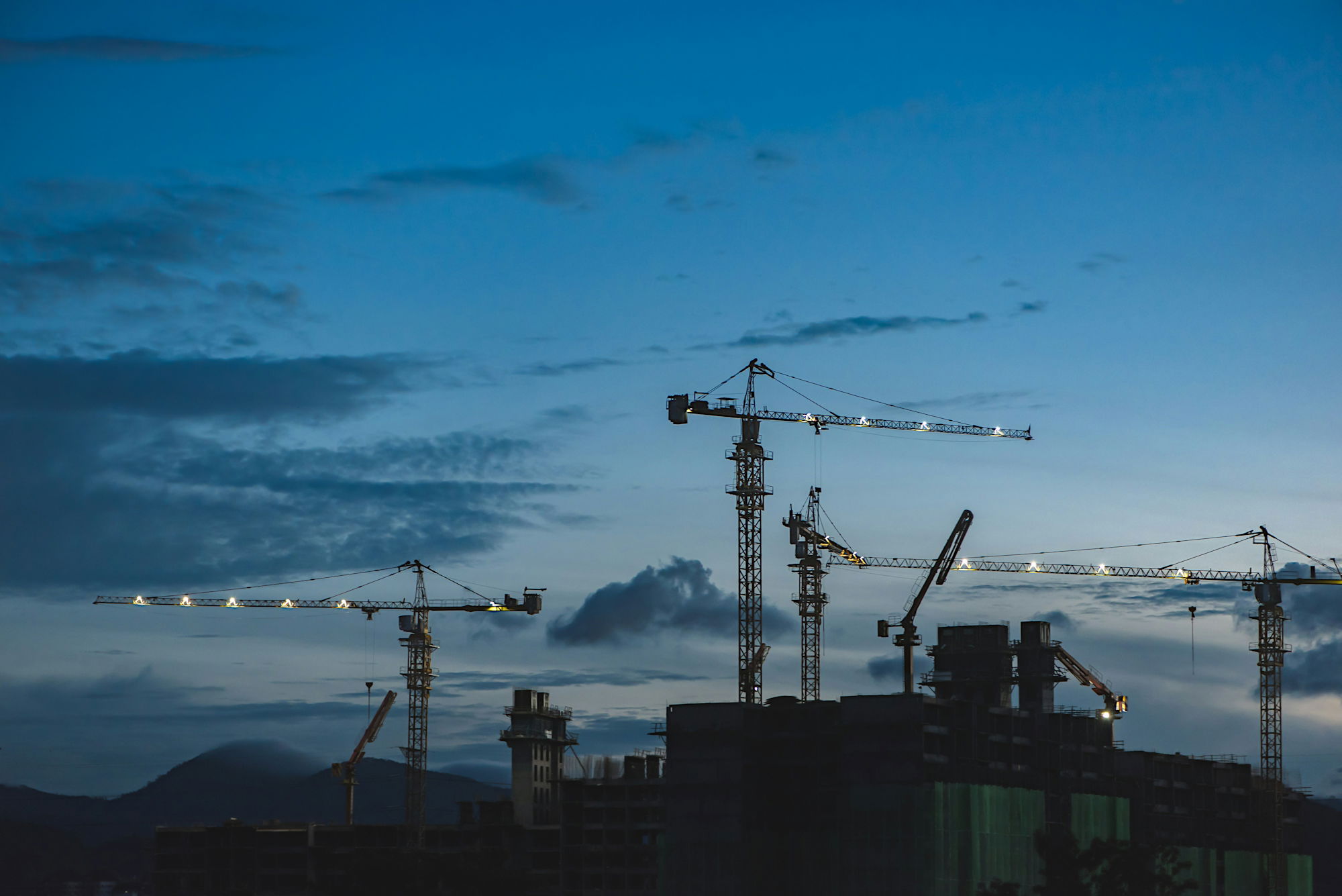 several-cranes-above-the-buildings.jpg several cranes above the buildings